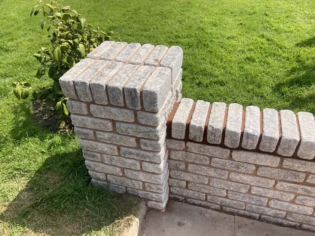Brick pier and low garden wall with brick-on-edge coping